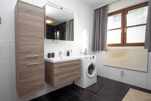 Shower, hair dryer, towels, toilet paper