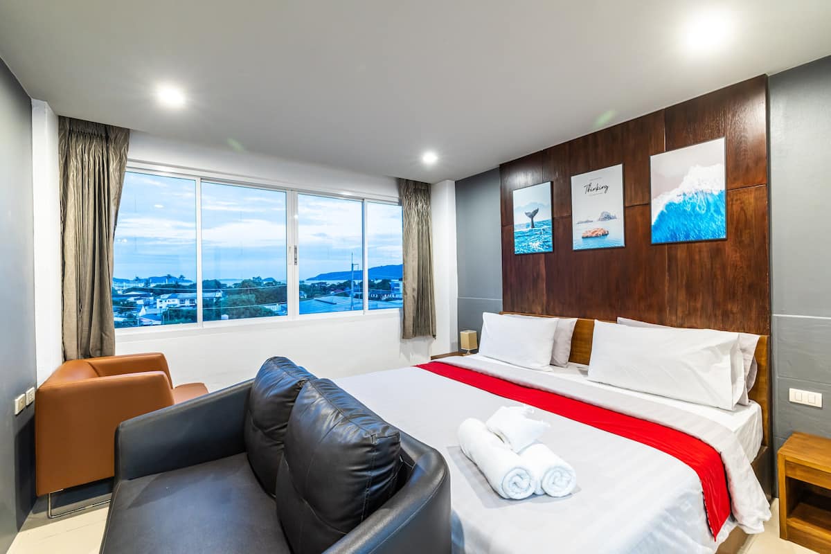 Habitación doble Deluxe, 1 cama King size, vista al mar | Ropa de cama de alta calidad y camas Tempur-Pedic
