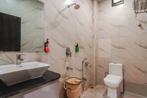 Deluxe Double Room | Bathroom | Shower, free toiletries, towels, soap - Travinities Hotel Asilo Prime (Indore)