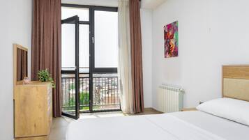 Executive Apartment, Balcony, City View | Blackout curtains, iron/ironing board, free WiFi