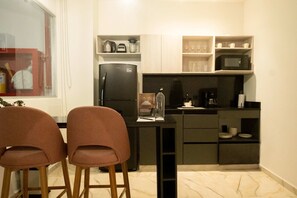 Fridge, microwave, stovetop, coffee/tea maker