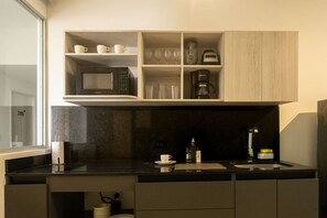 Fridge, microwave, stovetop, coffee/tea maker