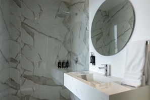 Shower, hair dryer, towels, shampoo
