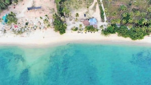 An aerial view of a beach with clear turquoise waters, a sandy shore, and scattered palm trees. - Villa With Private Pool and Mountain Views (Krabi)