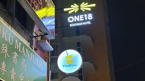 A building with signs for 'ONE18 Boutique Hotel' and 'YaoBites'. - ONE18 Boutique Hotel (Kuala Lumpur)