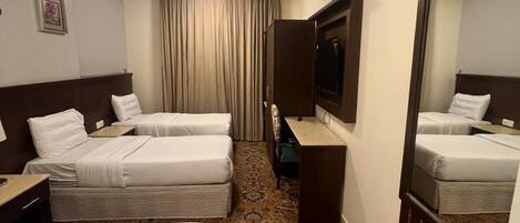 Deluxe Triple Room, City View | Iron/ironing board, free WiFi