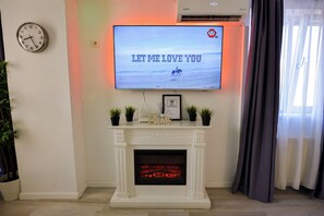Apartamento família, sacada | Área de estar