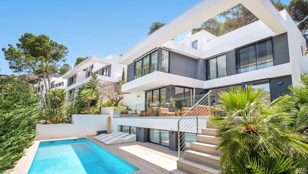 A modern multi-story house with a swimming pool, outdoor seating, and a staircase leading to the upper levels. - Villa Pinares de San Antón Sea, City & Mountain Views (Málaga)