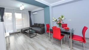 Superior Apartment | Living area | 40-inch LCD TV with cable channels, Netflix, streaming services - Bucharest Old Town Apartments (Bucharest)
