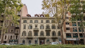 A multi-story building with a classic architectural style, featuring balconies and a central entrance. - Design in Corso Francia 1 by Wonderful Italy (Torino)