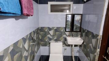 Shower, towels, soap, toilet paper