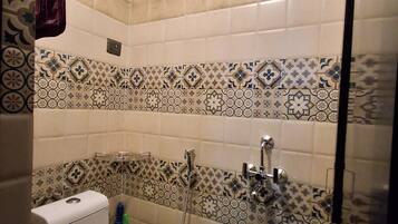 Shower, towels, soap, toilet paper