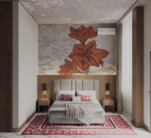A modern bedroom with a large bed, a decorative wall mural, and a patterned rug.