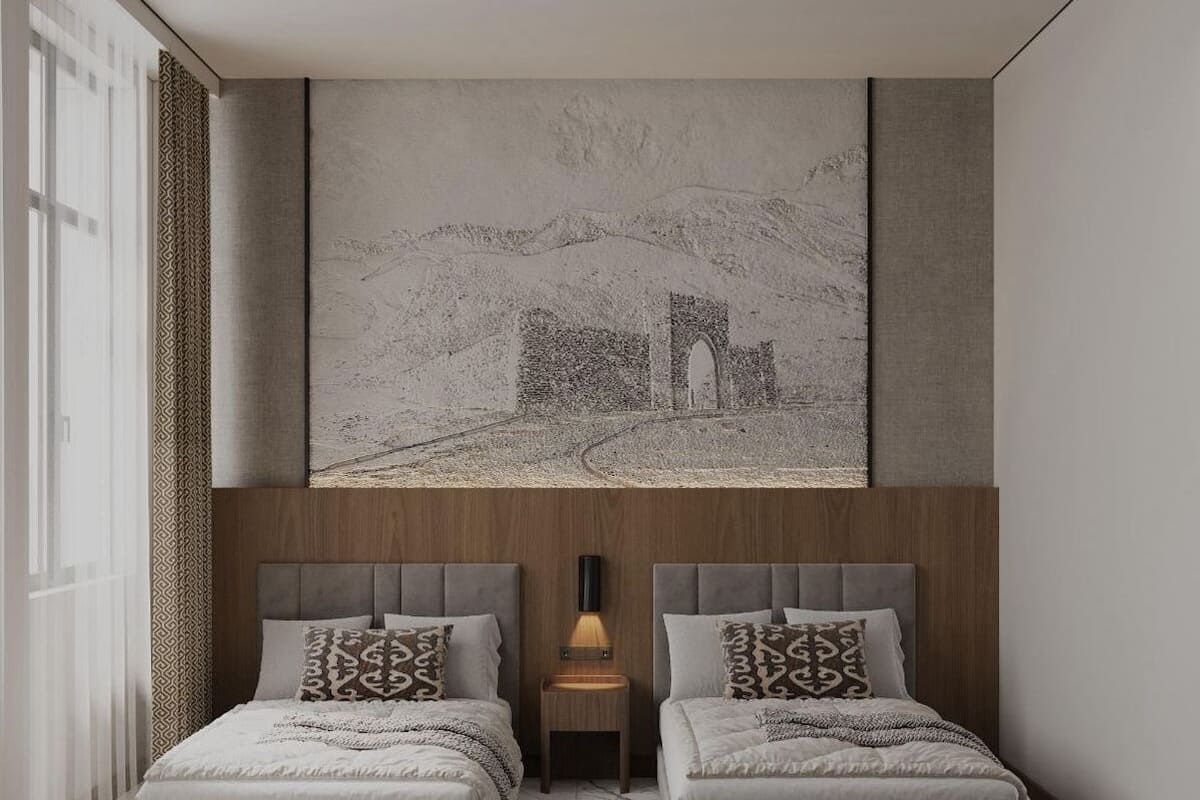A modern bedroom with two beds, a large wall mural, and a patterned rug.