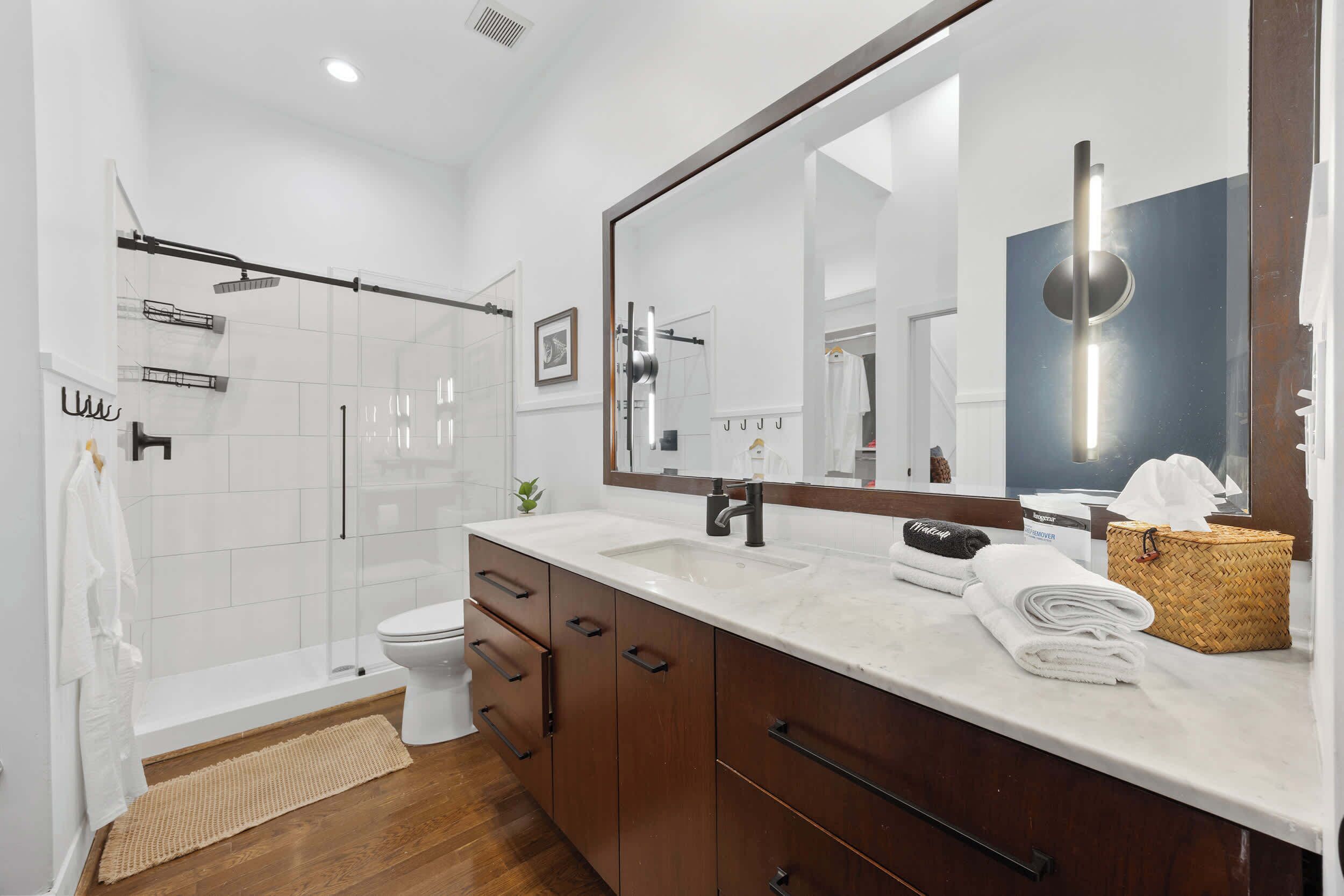 Shower, hair dryer, towels, shampoo