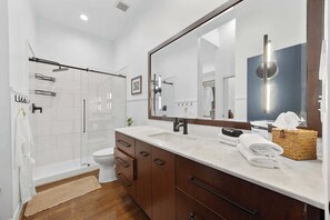 Shower, hair dryer, towels, shampoo