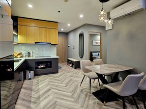 Deluxe Room, City View | In-room safe, desk, laptop workspace, soundproofing