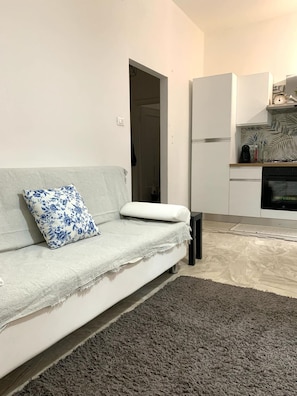 Apartment, 2 Bedrooms | Living area | 30-inch TV with satellite channels