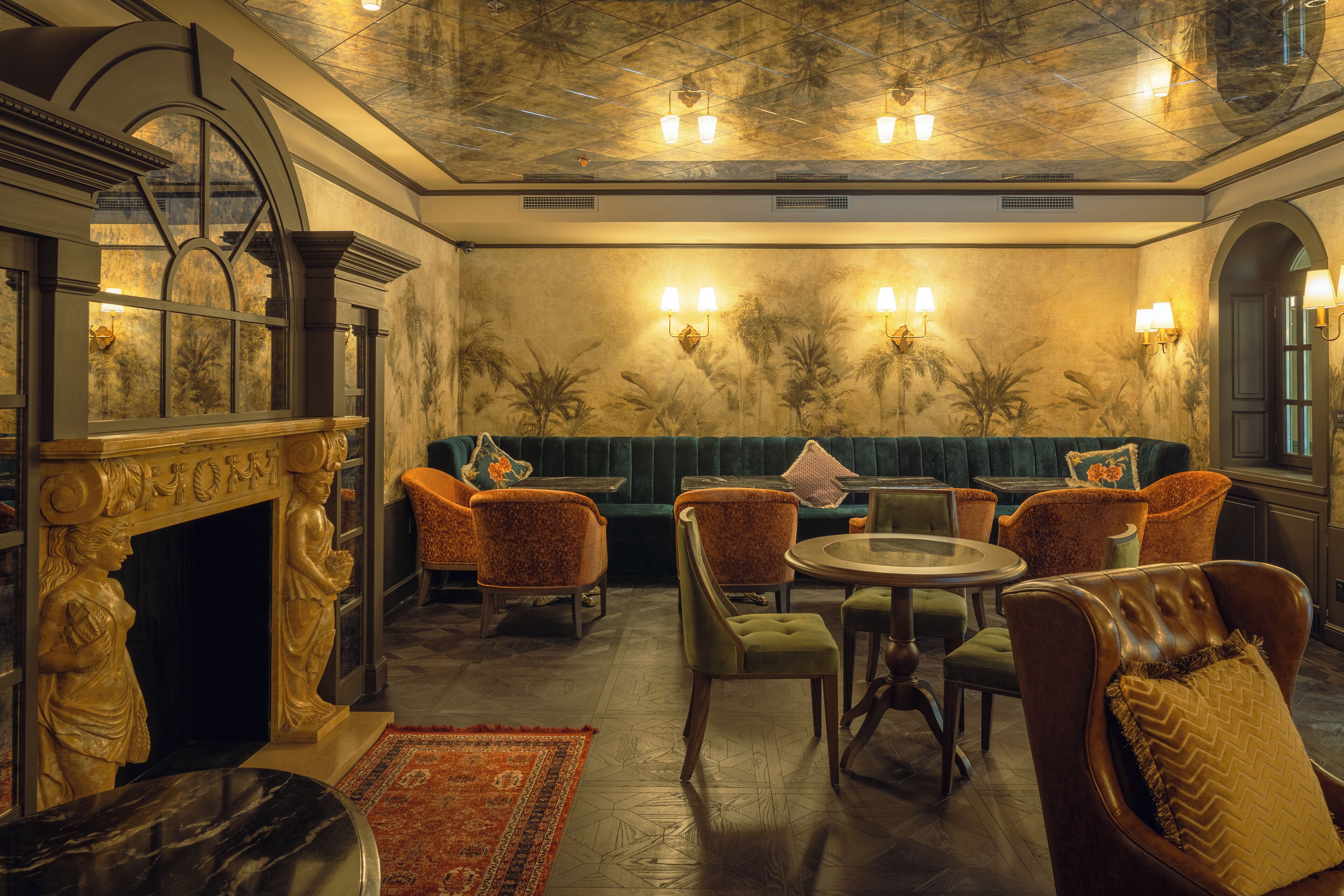 A luxurious room with a fireplace, seating area, and a dining table.