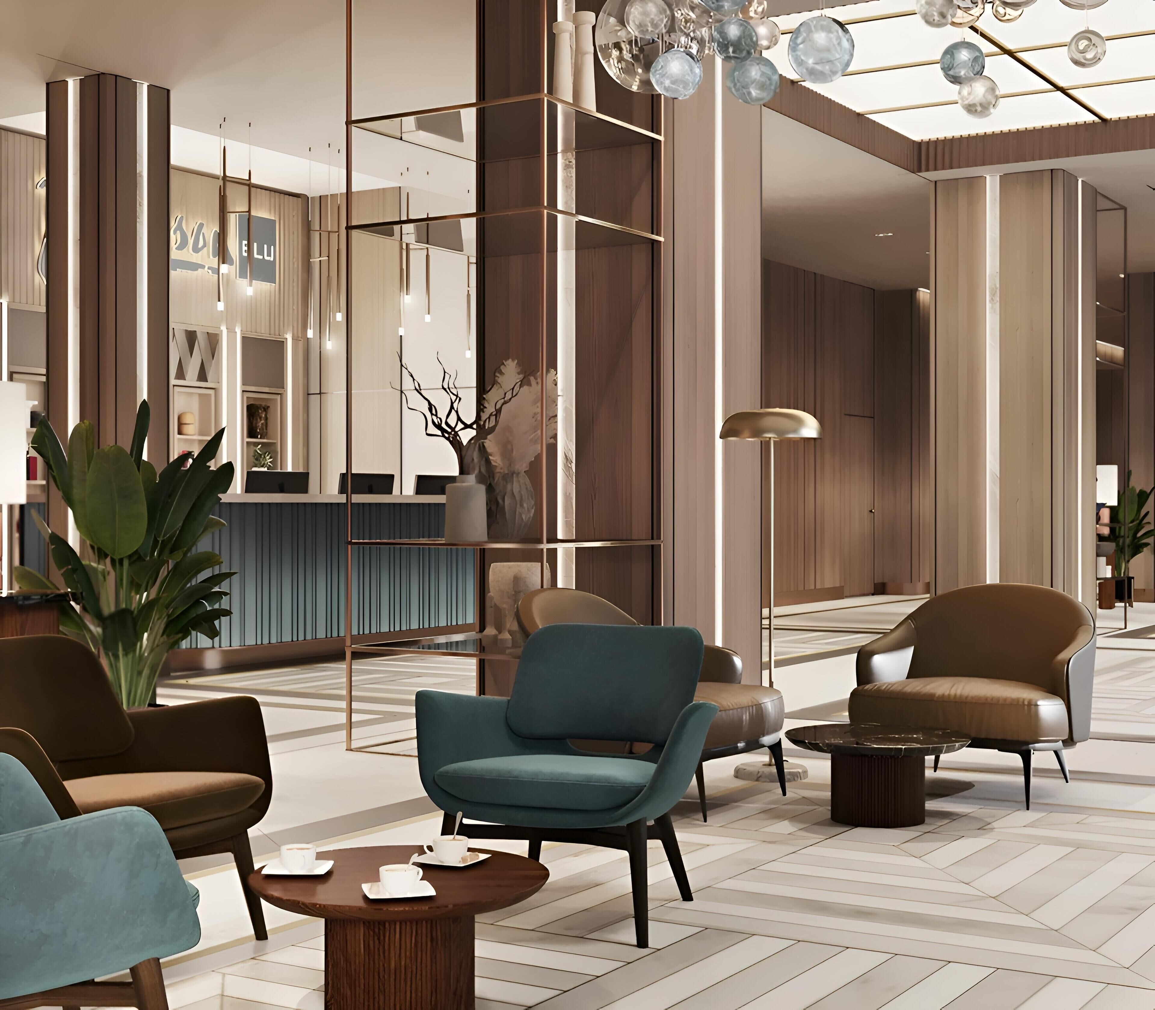 Un vestíbulo moderno con zonas de estar, un mostrador de recepción y una planta decorativa.