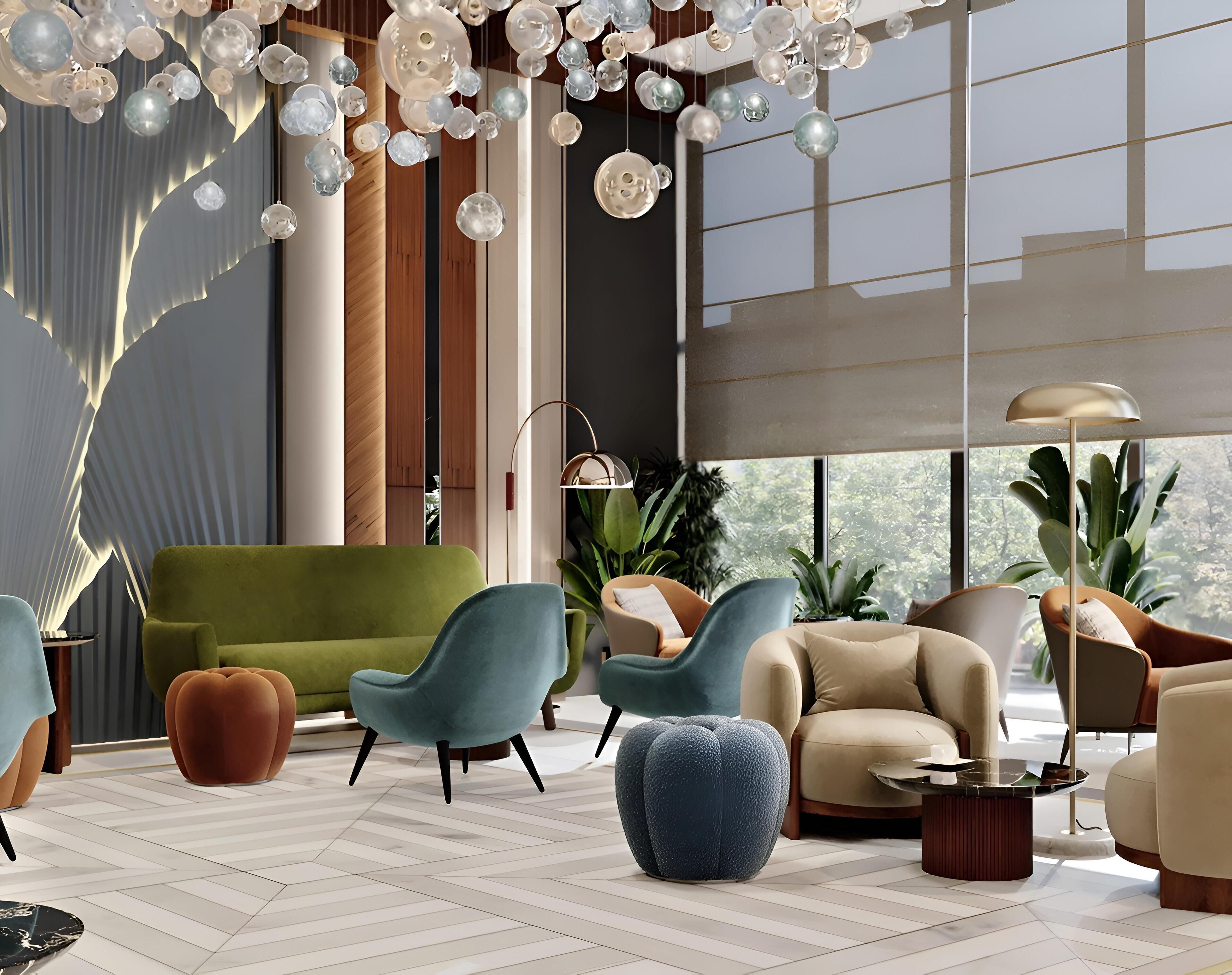 A modern living room with a green sofa, teal armchairs, and a beige armchair. There are potted plants, a floor lamp, and a coffee table.