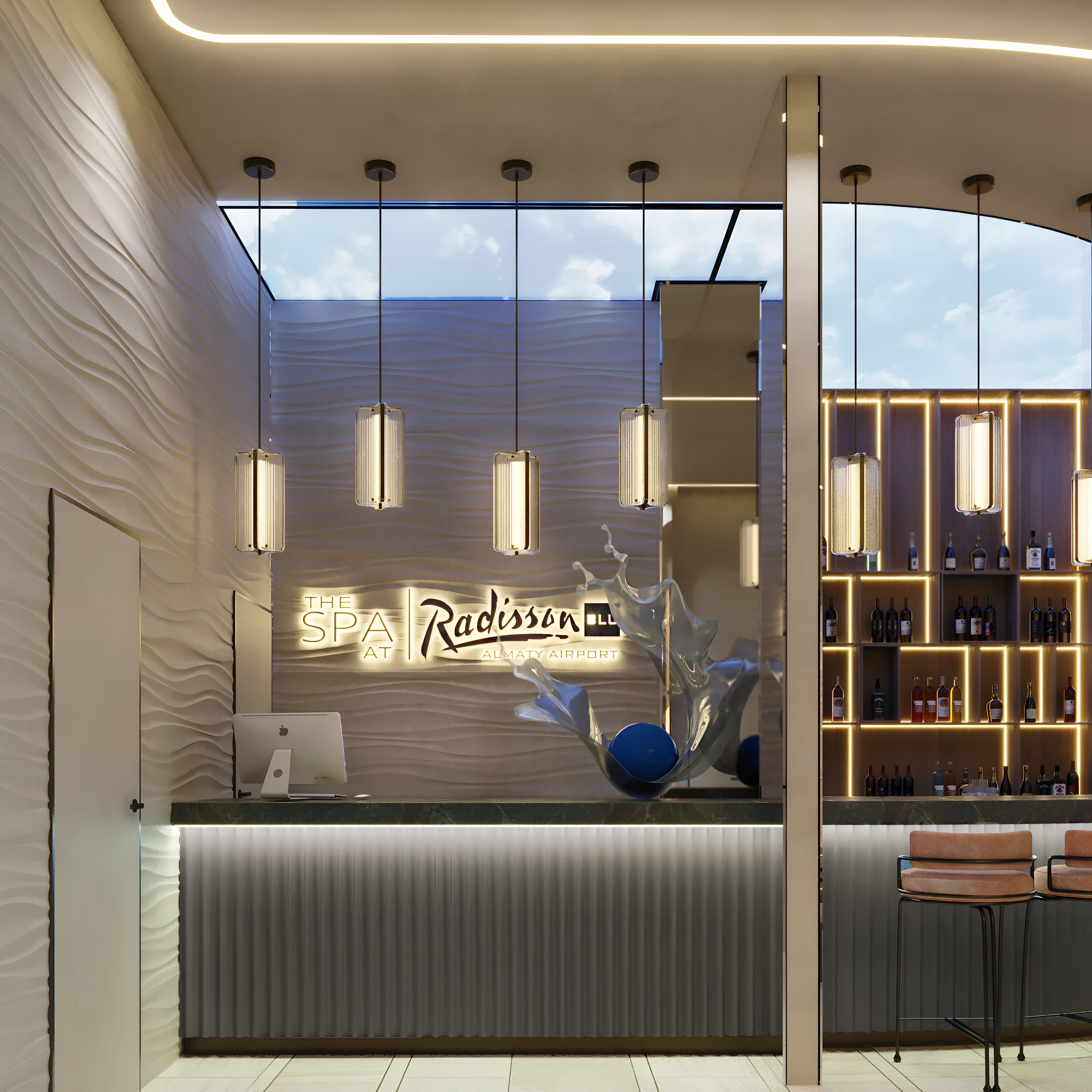 A reception area with a modern design, featuring a reception desk, a digital screen, and a bar area with shelves of bottles.