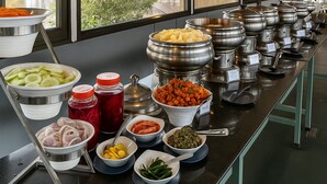A buffet setup with various food items and condiments. - River Splash Resort Neral Karjat (Karjat)