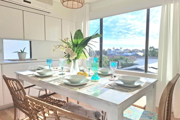 Dine in comfort at a spacious table and a charming view.