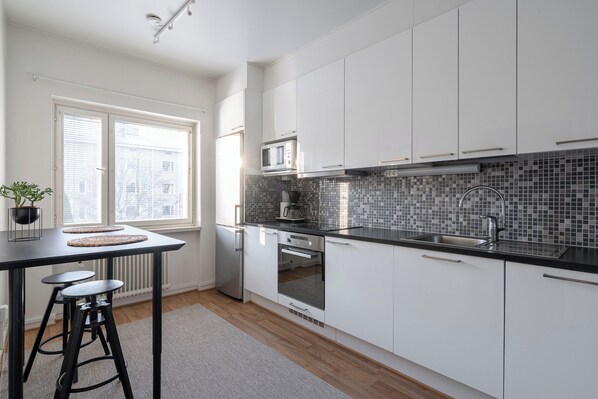 Comfort Apartment | Private kitchen | Full-size fridge, microwave, oven, stovetop