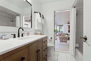 Shower, hair dryer, towels, shampoo
