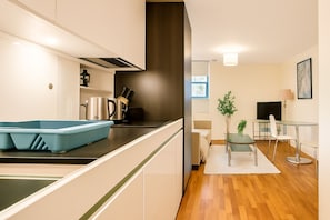 Apartamento luxo, 1 quarto | Área de estar
