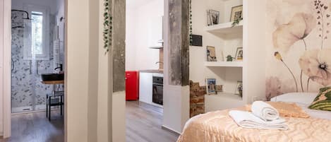 Apartment, Terrasse, Gartenblick | Reisekinderbett, kostenloses WLAN, Bettwäsche