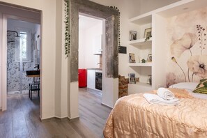 Apartamento, varanda, vista para o jardim | Berço de viagem, Wi-Fi de cortesia, roupa de cama