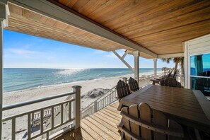A wooden deck with a view of the beach and ocean. - Welcome to DUNE IT RIGHT! (St. George Island)