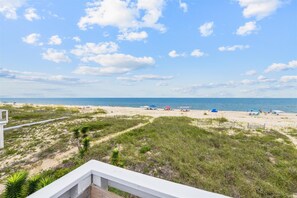 On the beach - Wander from the cool shade of the screened porch to the sun deck with your favorite book! (St. George Island)