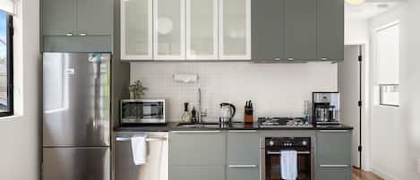 Coffee/tea maker, fridge, microwave, oven