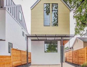 A modern two-story house with a covered patio area. - Austin Luxury 5BR Modern House | by Barclé (Austin)