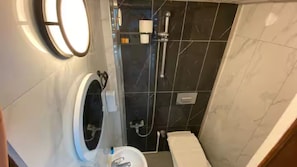 Shower, hair dryer, slippers, towels