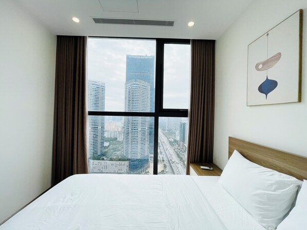 Deluxe Suite, City View | In-room safe, desk, laptop workspace, blackout drapes