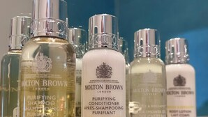 A collection of Molton Brown toiletries on a shelf. - The Hambrough (Ventnor)