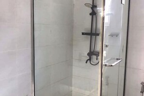 Shower, towels, soap, toilet paper