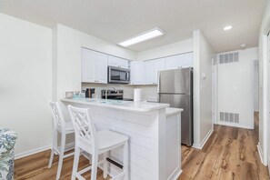 Fridge, microwave, oven, stovetop - Canal Front Condo with Pool (Ocean City)