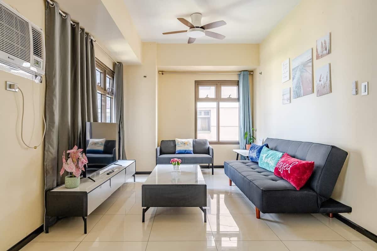 Standard Apartment, 3 Bedrooms, Balcony, Pool View | Living room | 50-inch Smart TV with digital channels