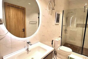 Shower, towels, soap, toilet paper