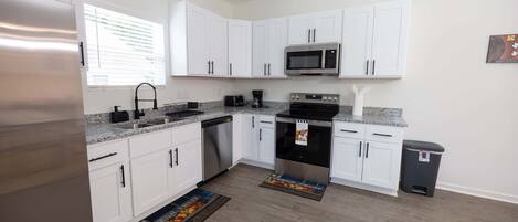 Fridge, microwave, stovetop, coffee/tea maker