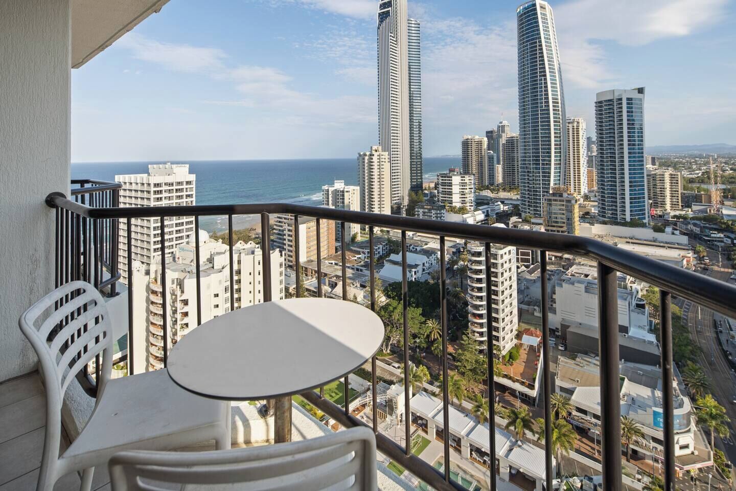 Enjoy your own elevated retreat with outdoor seating and uninterrupted vistas stretching from the beach to the glittering city skyline.