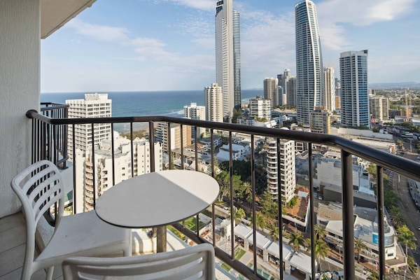 Enjoy your own elevated retreat with outdoor seating and uninterrupted vistas stretching from the beach to the glittering city skyline.