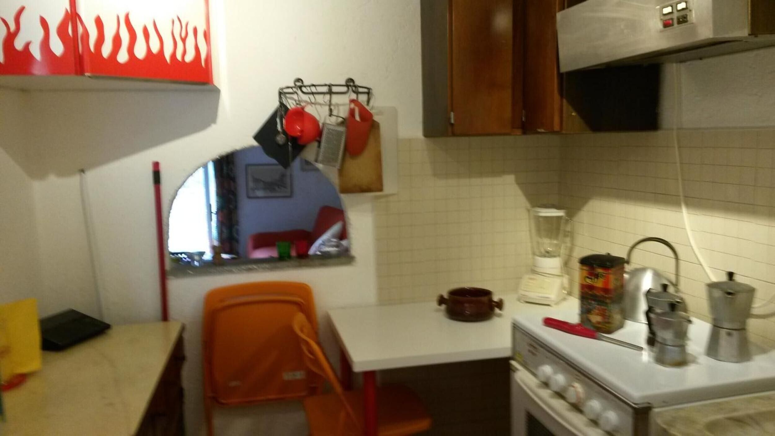 A kitchen with a stove, oven, and various appliances.