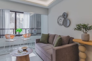 One-Bedroom Suite with Balcony - Suite 2 | Living area | 50-inch Smart TV with satellite channels, Netflix, streaming services
