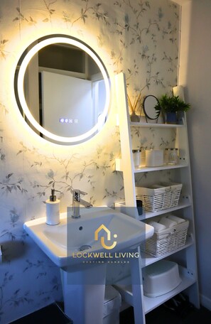 Hair dryer, towels, soap, shampoo